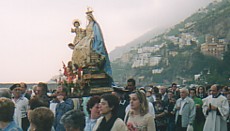 The Madonna is carried in a procession from the sea