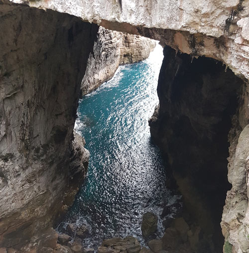 Rock arch over sea