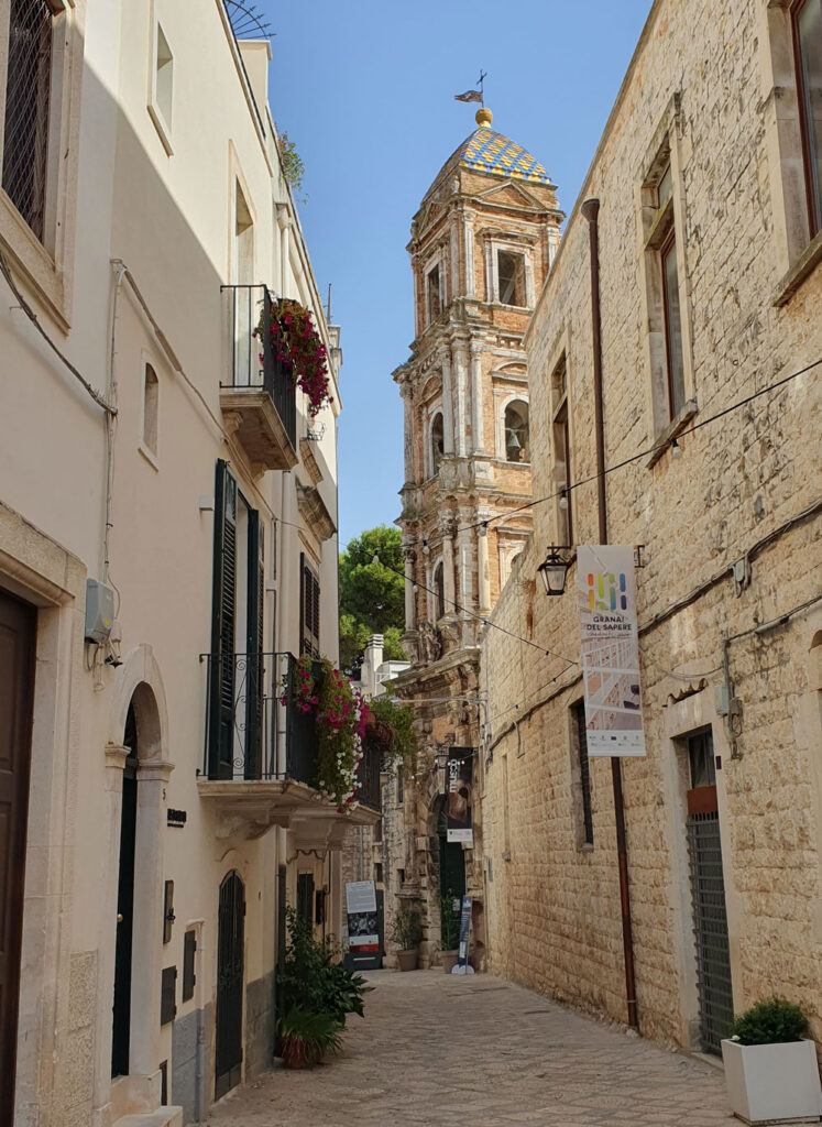 Tourist info-point (foreground) and the campanile of the Monastero di San Benedetto, Conversano