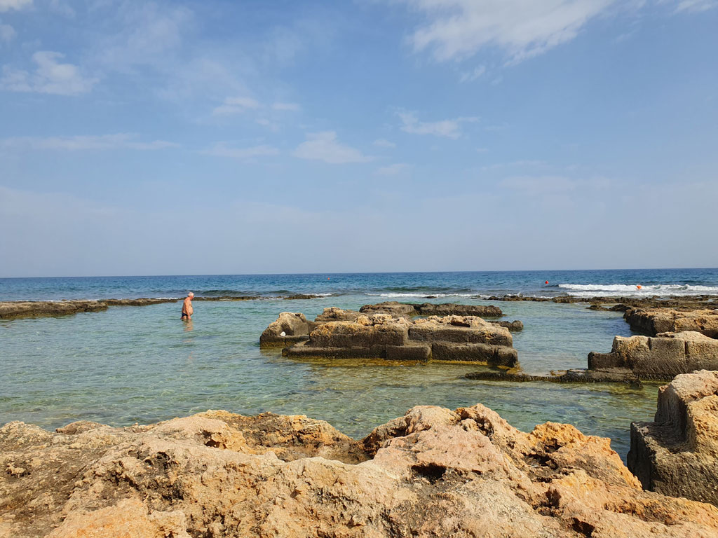 Sea and rock pools at the Abbazia di San Vito, Polignano